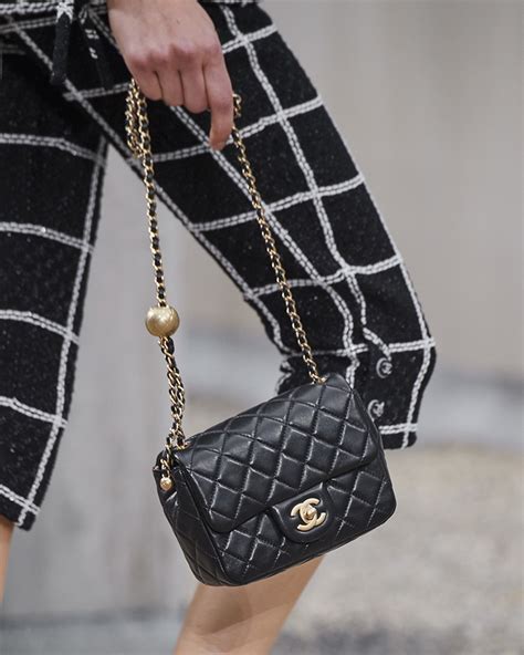 woman holding chanel handbag|cheapest chanel bag 2020.